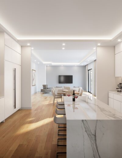 Modern kitchen with white cabinetry, marble countertops, and stainless steel appliances opening up to a living area with a dining table and seating.